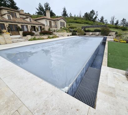 Gray pool cover mediterranean villa hillside