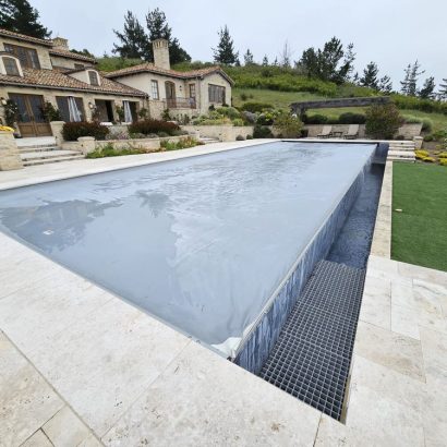 Gray pool cover mediterranean villa hillside