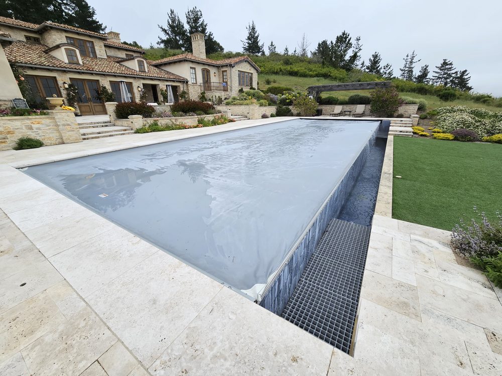 Gray pool cover mediterranean villa hillside